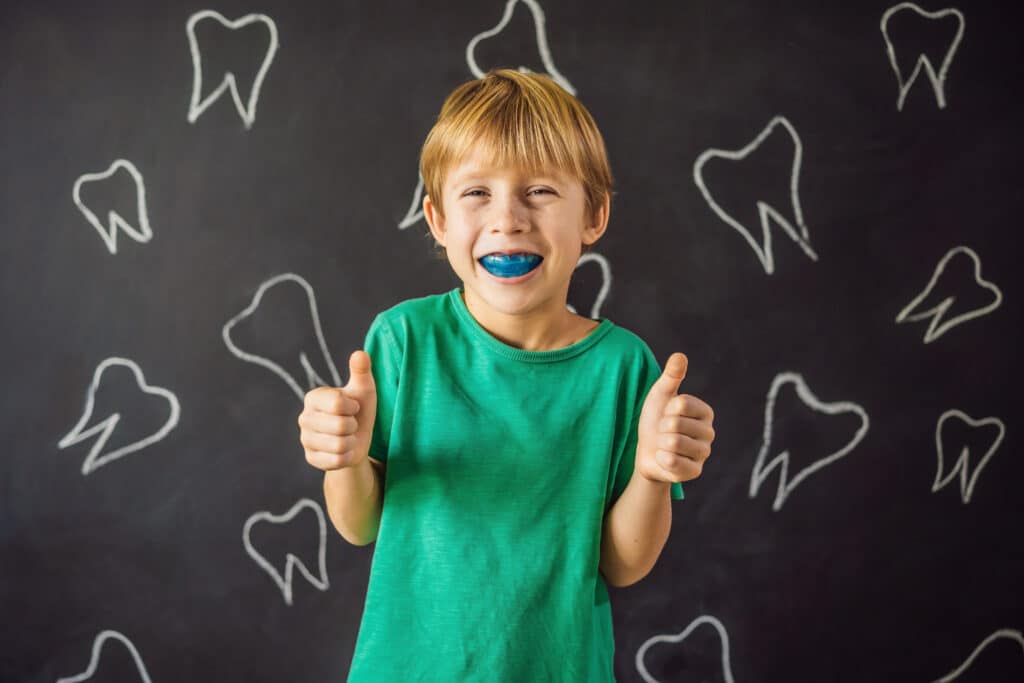 Six-year old boy shows myofunctional trainer