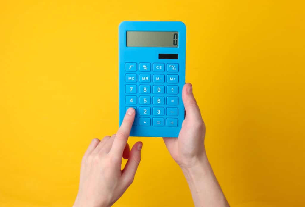 Hand holds blue calculator