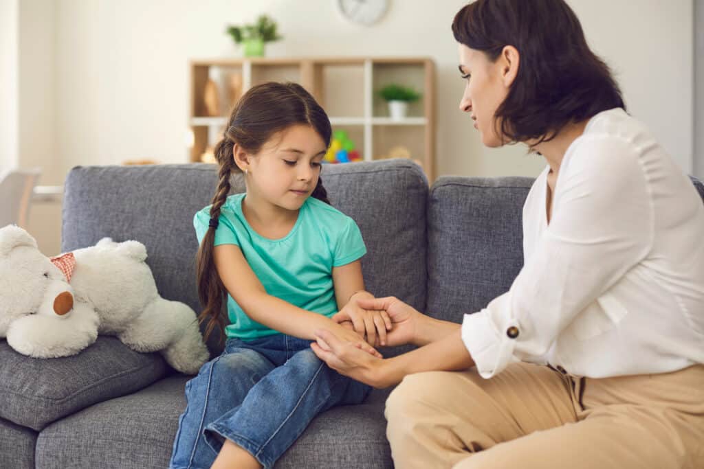 Mother sitting with daughter